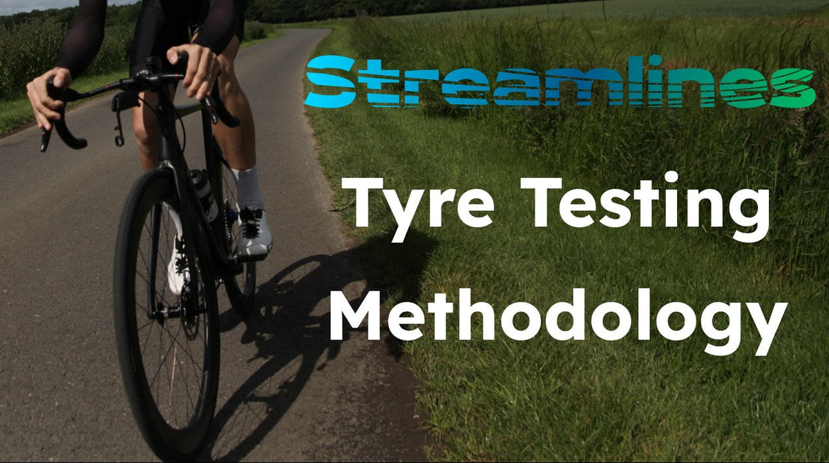 A cyclist rides a road bike on a country road with overlaid text reading 'Streamlines Tyre Testing Methodology' on a green field background.